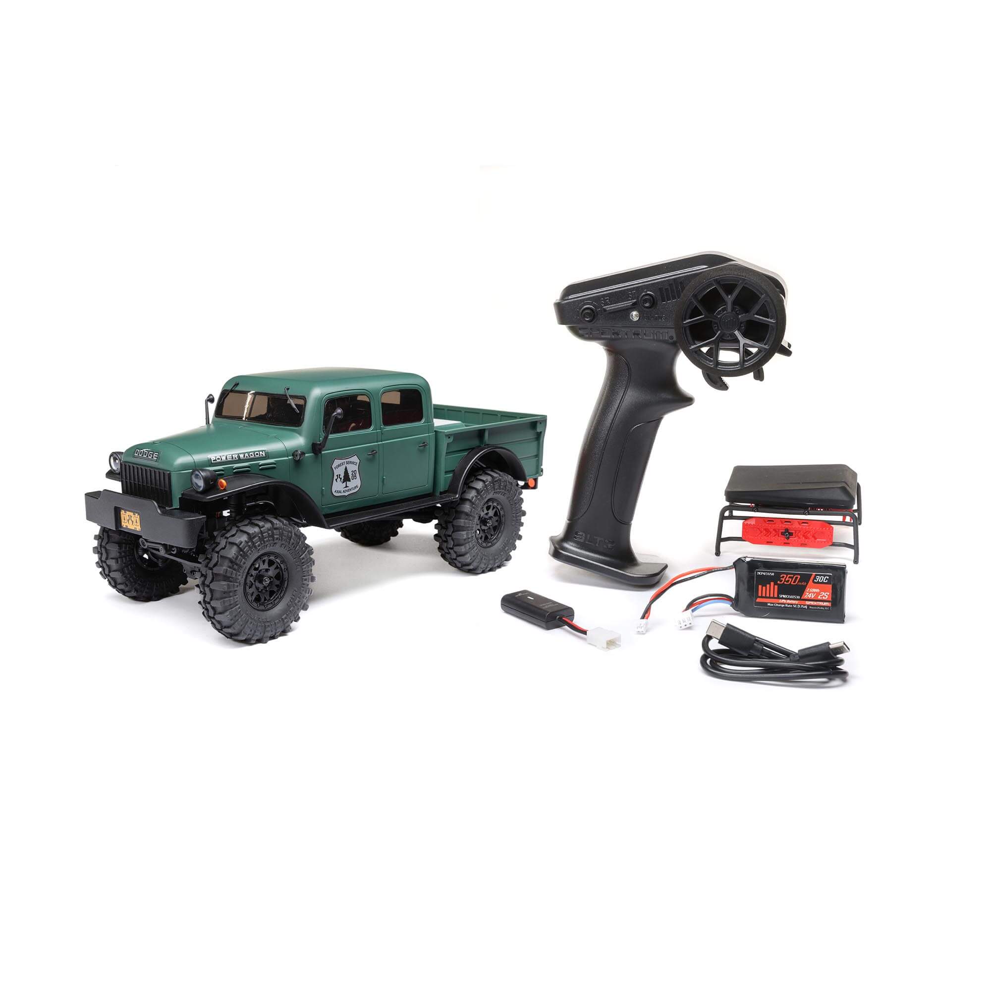Official green Axial Power Wagon package photo with SLT2 transmitter, battery, USB charger and optional rack accessories