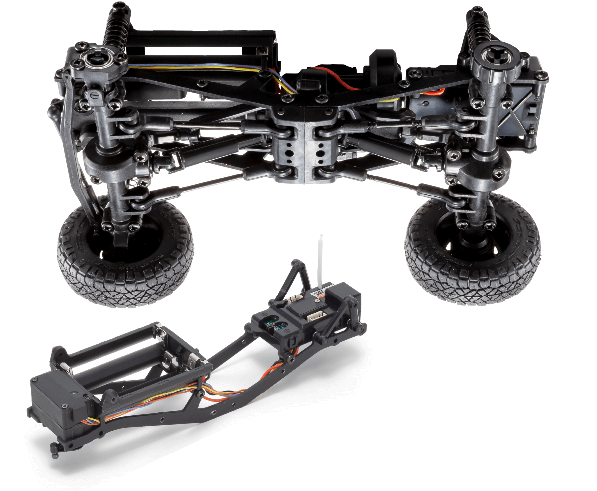 Kyosho official MX-01 chassis illustration: ladder frame, solid axles, links and electronics. Technical illustration, not a drive-test photo.