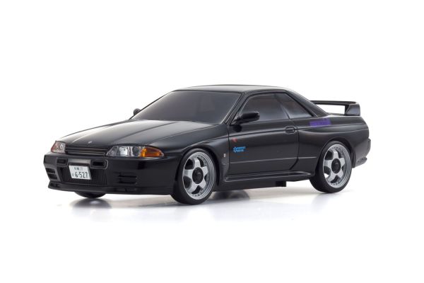 Official close three-quarter photograph of the finished black Initial D R32 V-SPEC II MINI-Z body